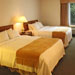 The perfect room for your family; A  Rosemont Suites room with double queen beds and kitchenette easily accommodates a family of four on a weekend getaway to Eastern CT.